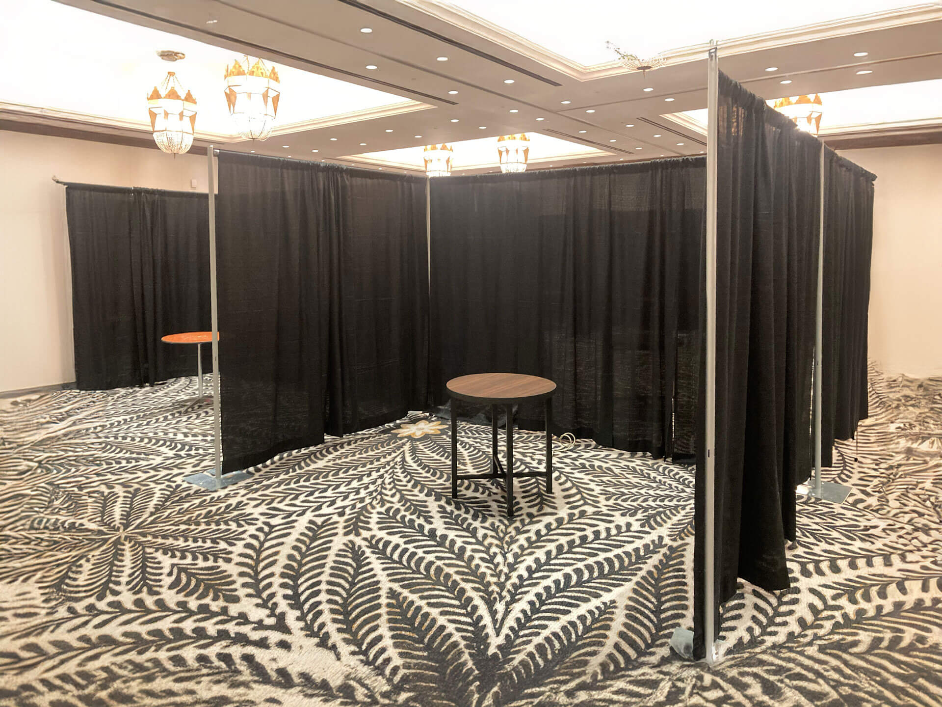 Upright drape booths setup at Omni Montelucia